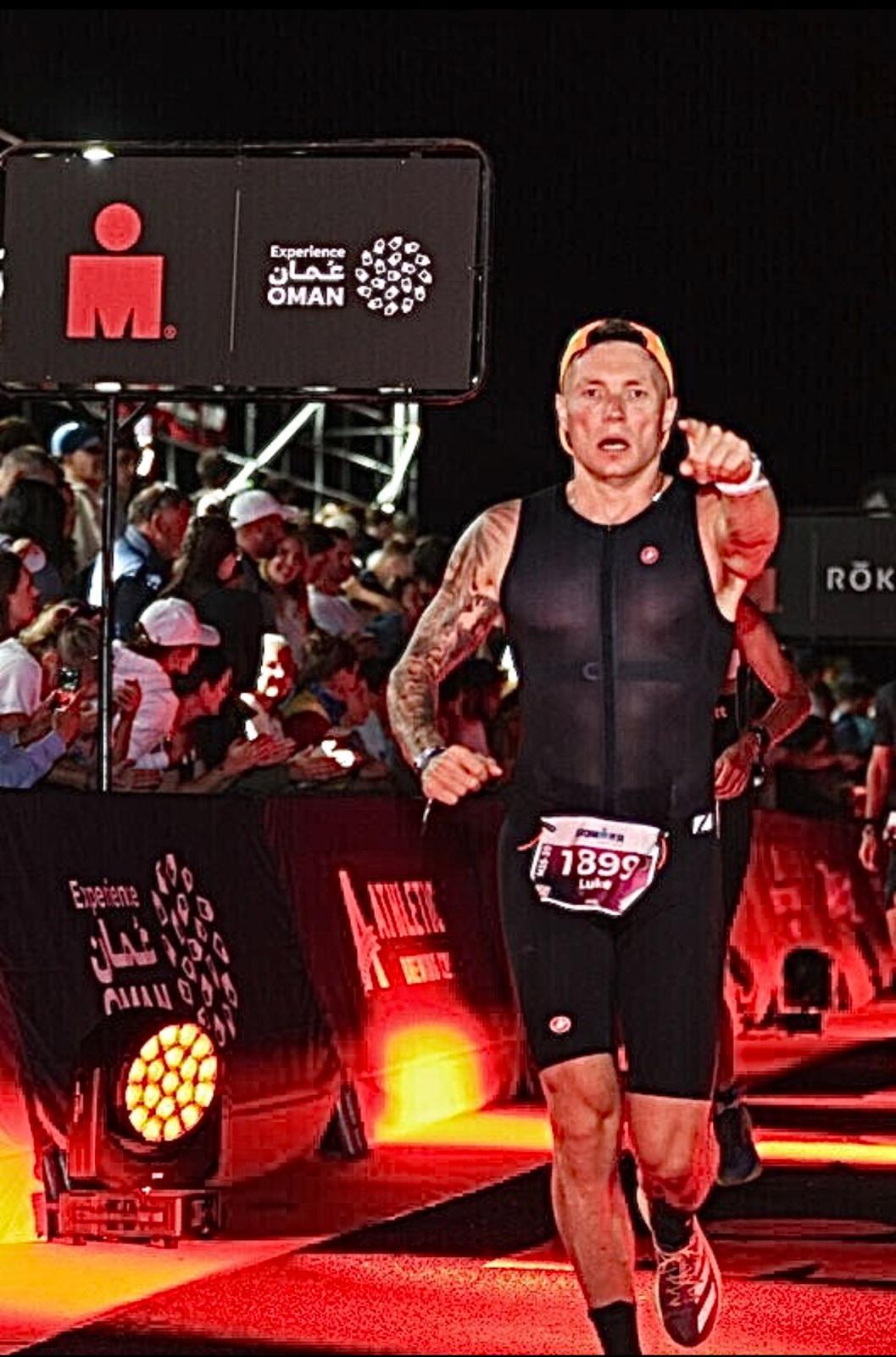 Luke B. finishing his first Ironman in Barcelona